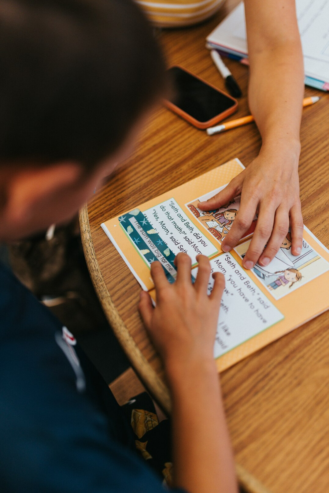person reading report at desk